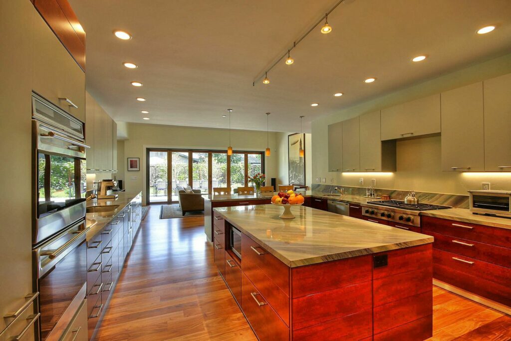 View of kitchen and NanaWall Bifold Doors and Moving Glass Walls from the kitchen at new house built in Palo Alto by Lynstar Jack Cannon General Contractor