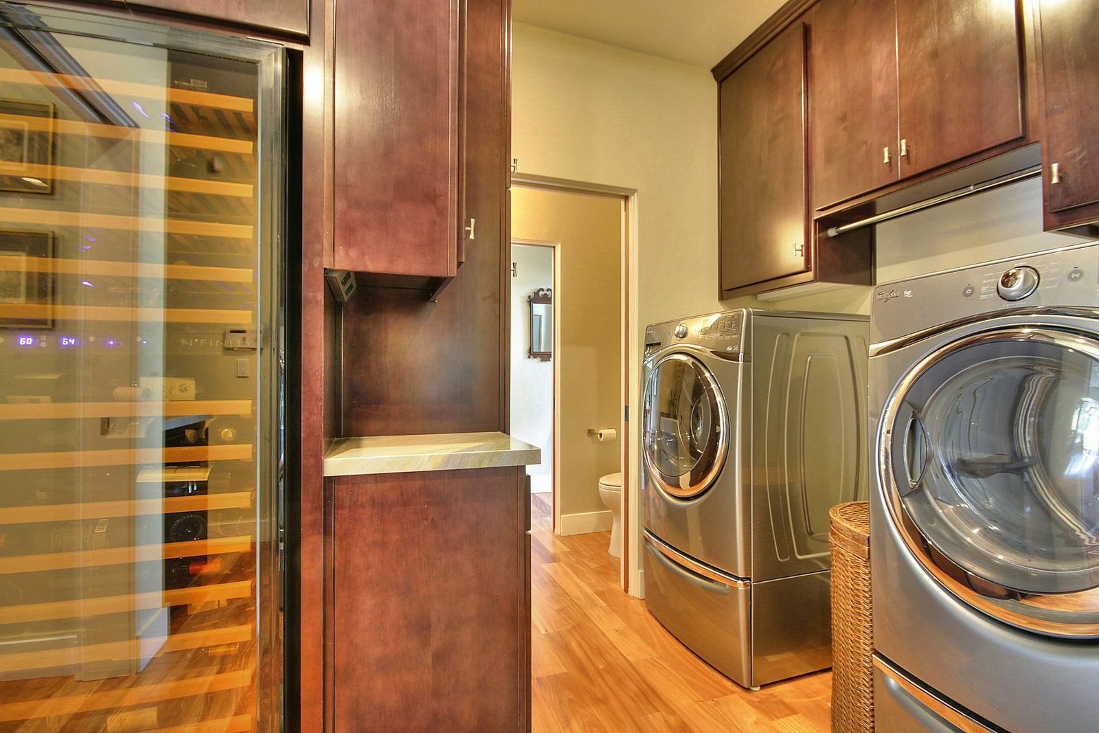 Laundry area with built-in wine refrigerator
